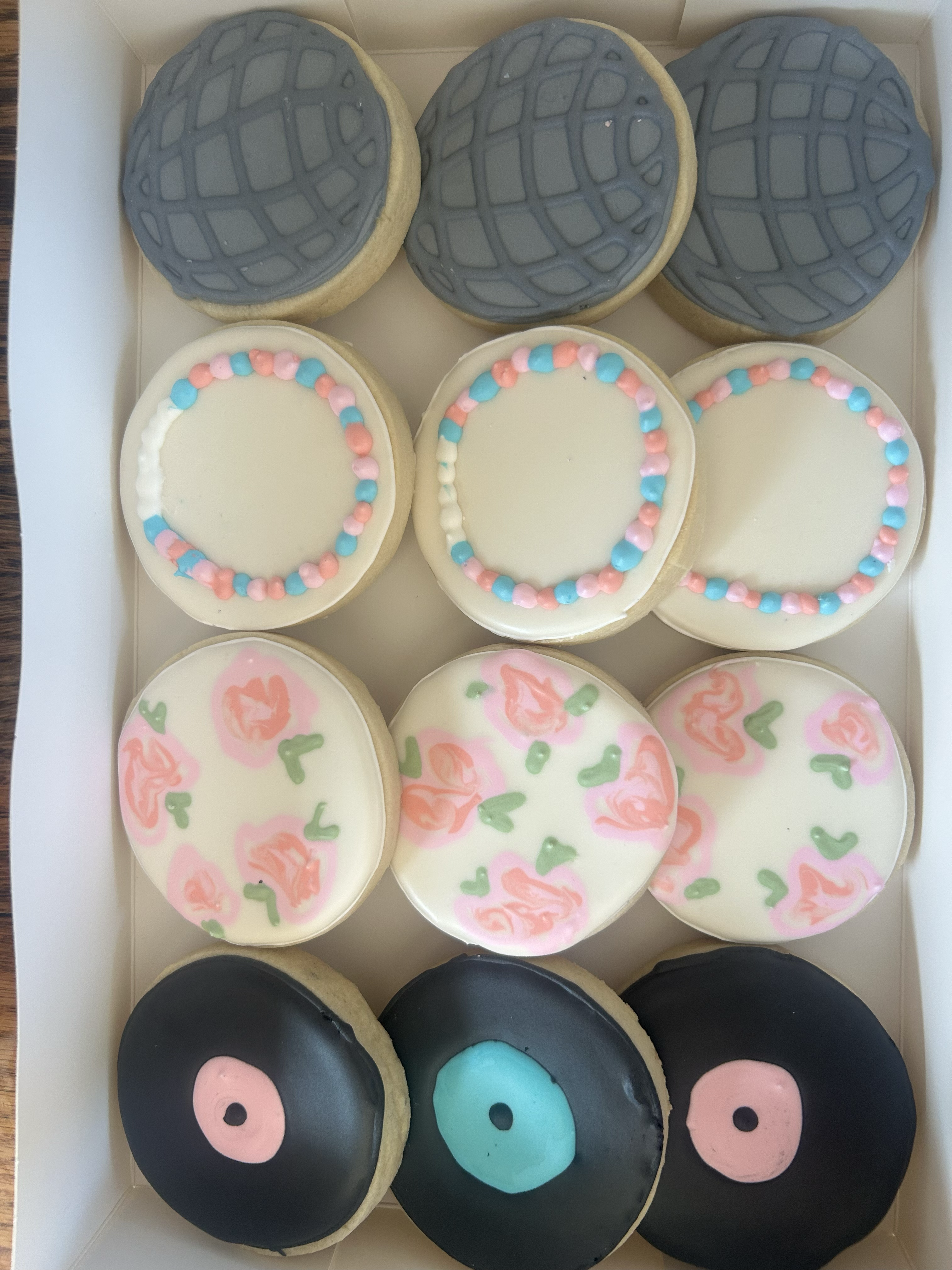 Assorted decorated sugar cookies in box