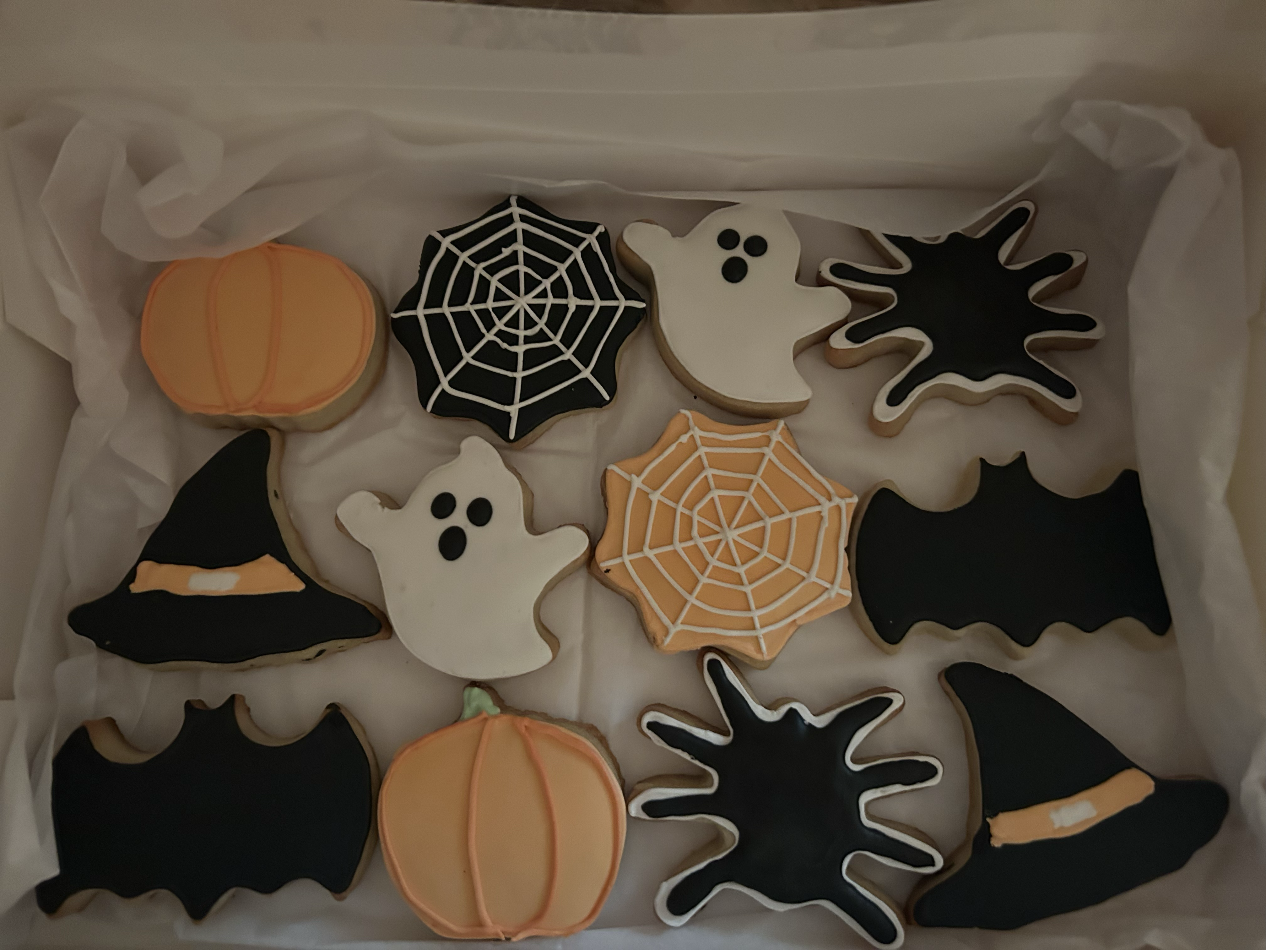 Halloween themed sugar cookies with pumpkins, ghosts, bats and witch hats